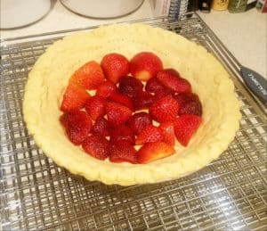 Fresh Strawberries in the crust waiting for the rest of the ingredients