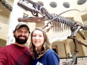 Me and my husband in front of a dinosaur skeleton at the Fernbank Science Museum in Atlanta, Georgia