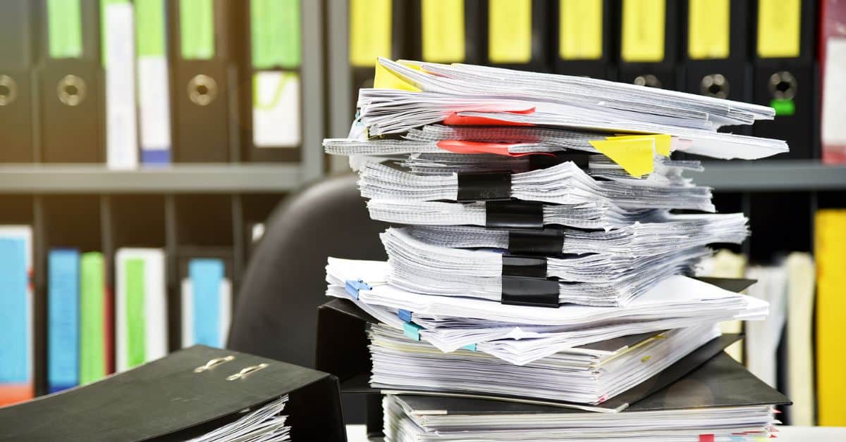 Paper clutter- Paperwork- Going through Paper- Paper on Desk- Declutter- Organize Paperwork