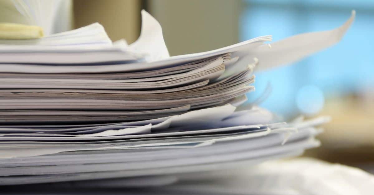 Decluttering Bills, Coupons, Papers- Pile of Papers on a Desk
