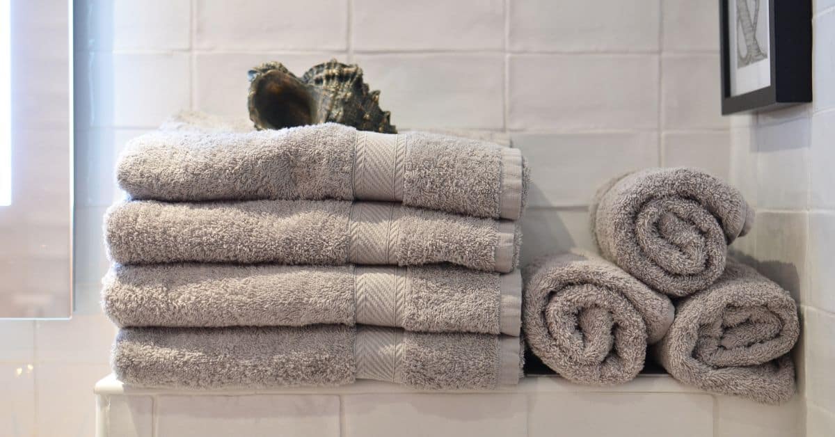 Decluttering your Towels and Sheets- Pile of Towels in a Bathroom
