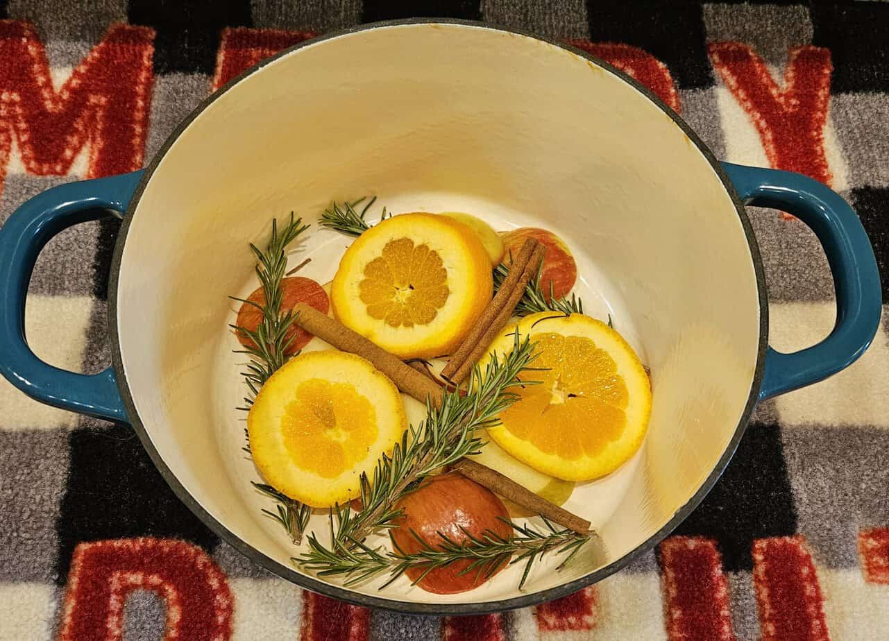 Christmas simmer pot recipe ingredients- Rosemary, apple, orange, cinnamon sticks